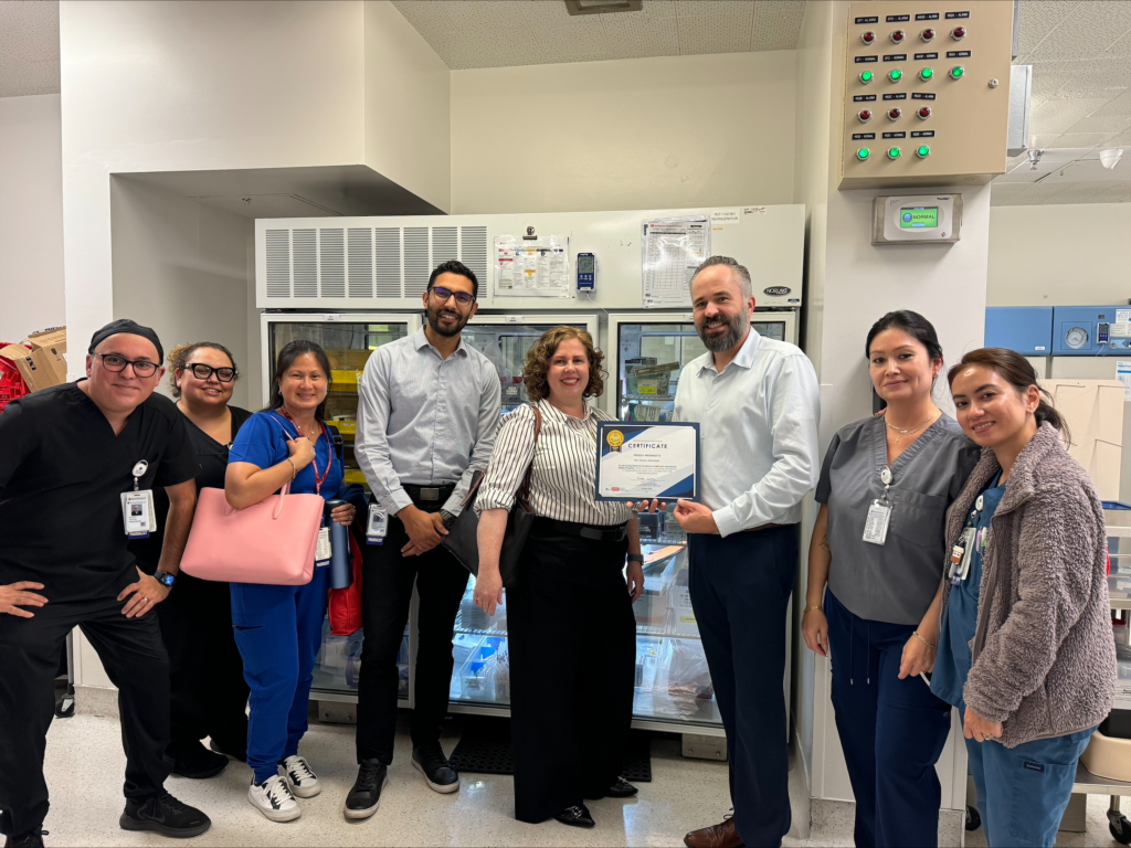 Medical staff holding award